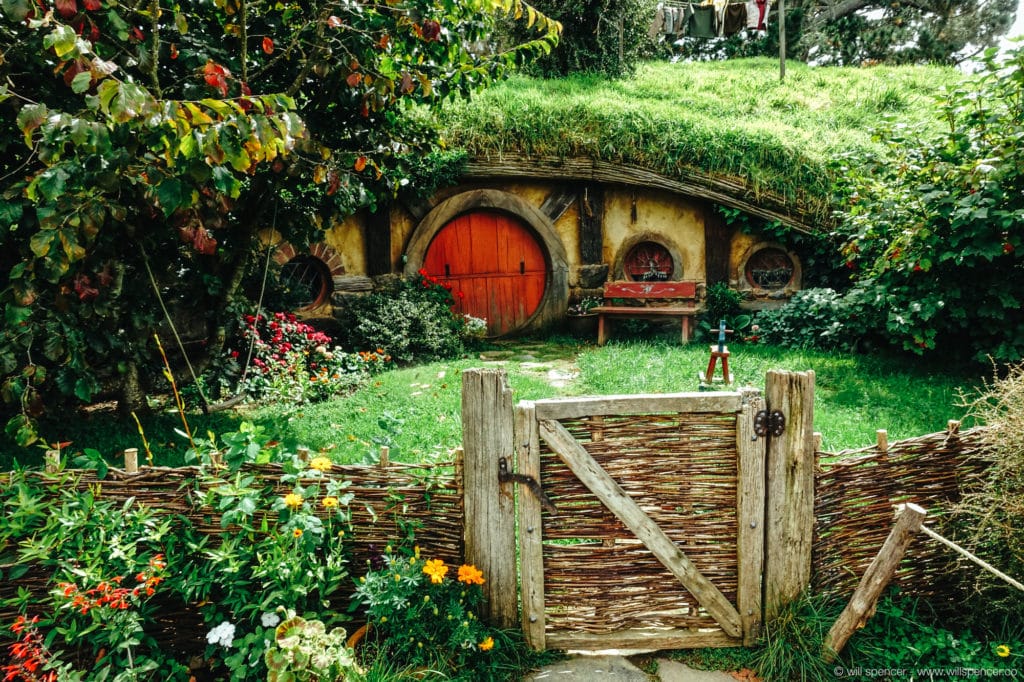 A Hobbit Hole and garden in the sun.